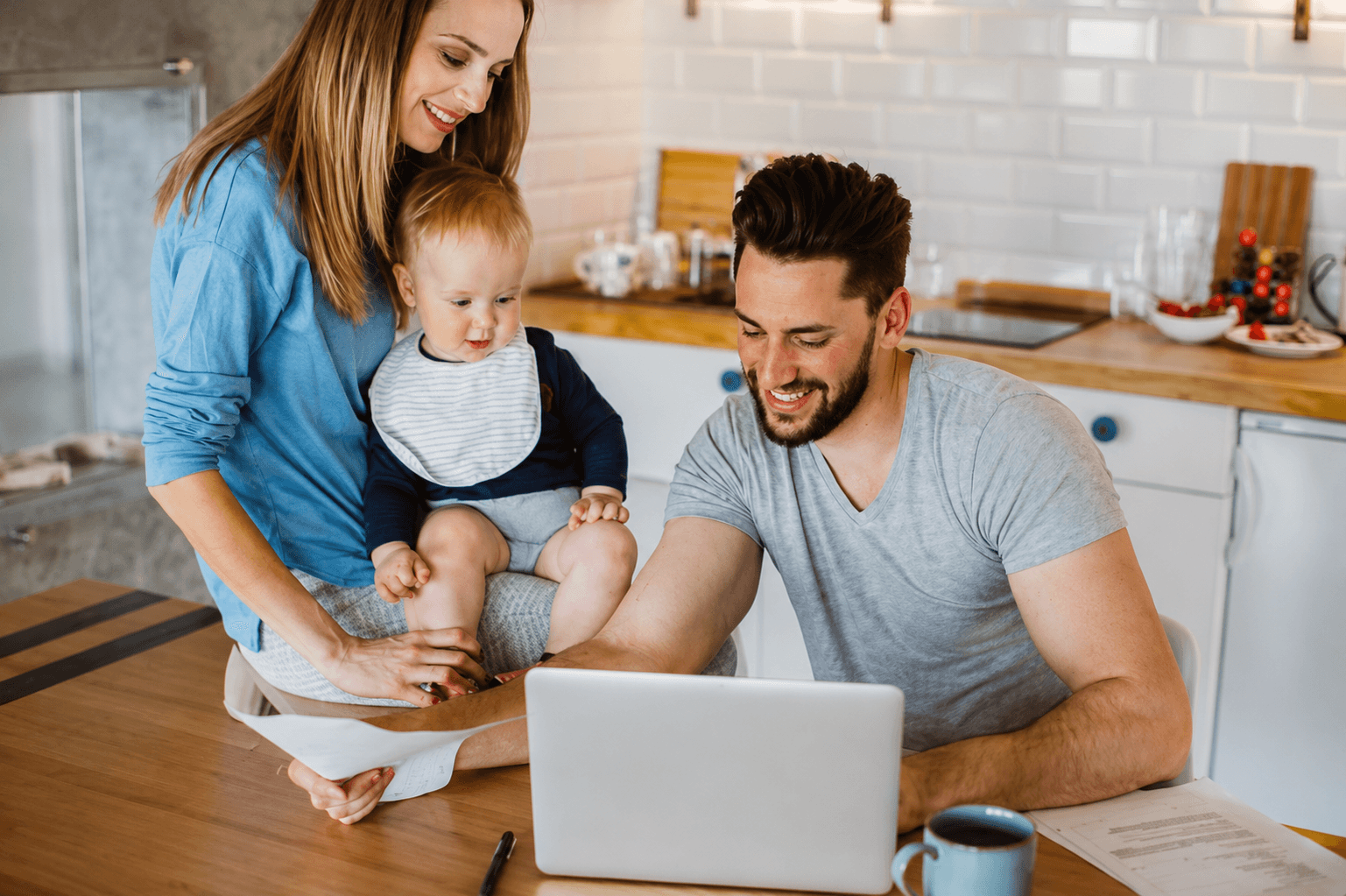 Family reviewing finances together at home